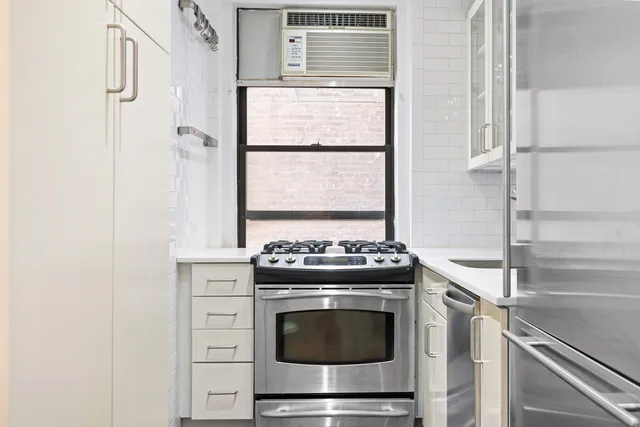 a bathroom with a granite countertop sink and mirror