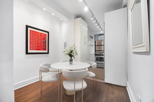 a stove top oven sitting inside of a kitchen