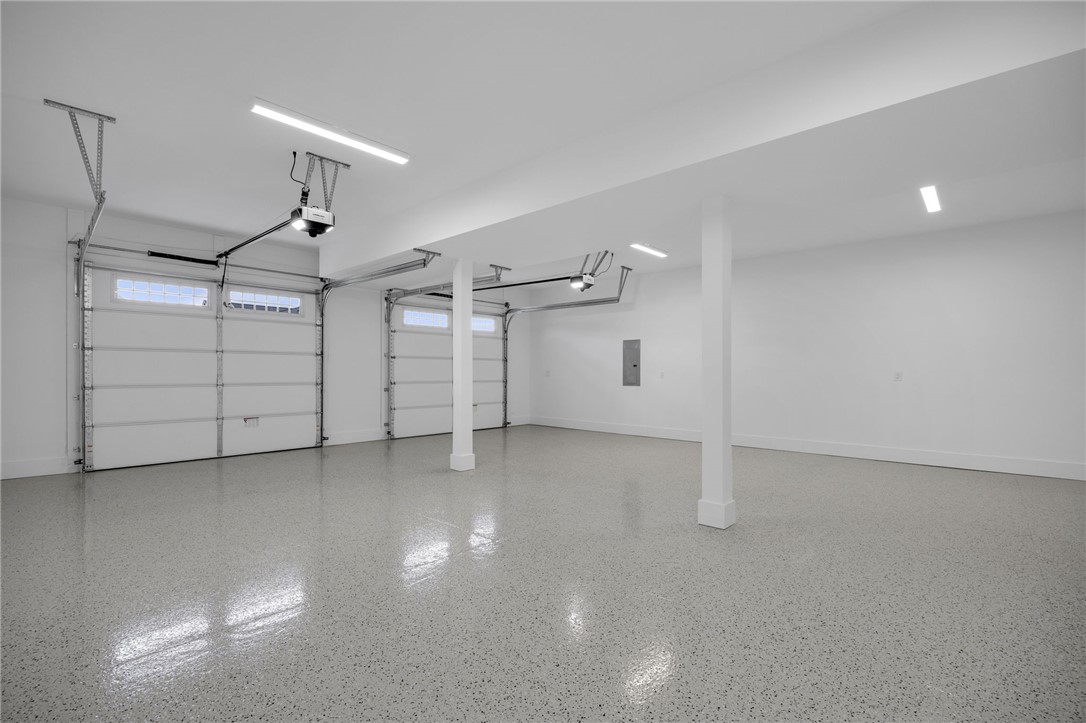 1230 Melton Road, Unit 216 West Union, SC 29696 - Photo 35 of 49 A spacious, well-lit garage features two overhead doors and a durable, easy-to-clean floor finish.