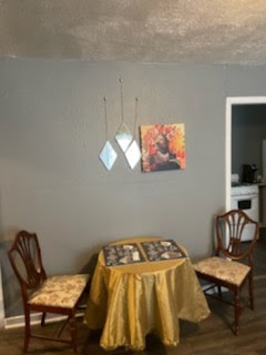 1828 Rosedale Street Houston, TX 77004 - Photo 12 of 32 a bedroom with a bed and a chair