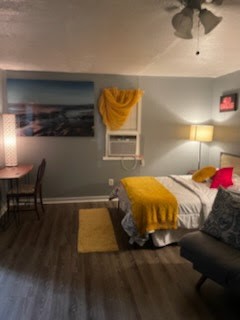 1828 Rosedale Street Houston, TX 77004 - Photo 14 of 32 a bed sitting in a bedroom next to a lamp