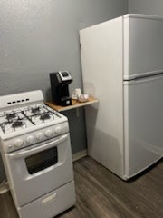 1828 Rosedale Street Houston, TX 77004 - Photo 27 of 32 a white stove top oven sitting inside of a kitchen