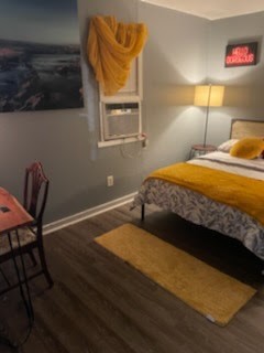 1828 Rosedale Street Houston, TX 77004 - Photo 32 of 32 a bedroom with a bed and a window