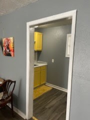 1828 Rosedale Street Houston, TX 77004 - Photo 5 of 13 a view of kitchen filled with furniture and wooden floor
