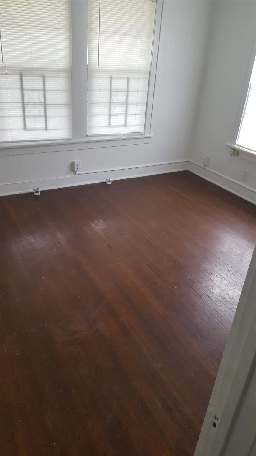 1828 Rosedale Street Houston, TX 77004 - Photo 6 of 13 an empty room with a window