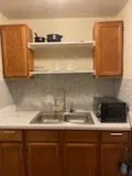 a close view of sink and cabinets