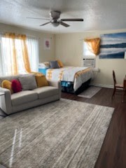 1828 Rosedale Street Houston, TX 77004 - Photo 9 of 32 a spacious bedroom with a bed window and couch