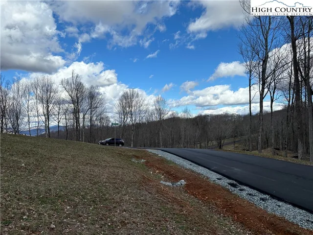 a sign broad in front of a white building
