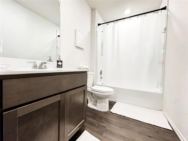 a view of bathroom with a sink and mirror