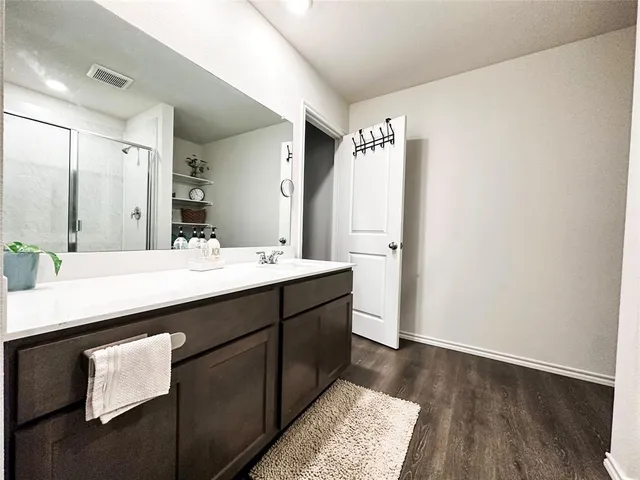 a bathroom with a sink double vanity and a mirror