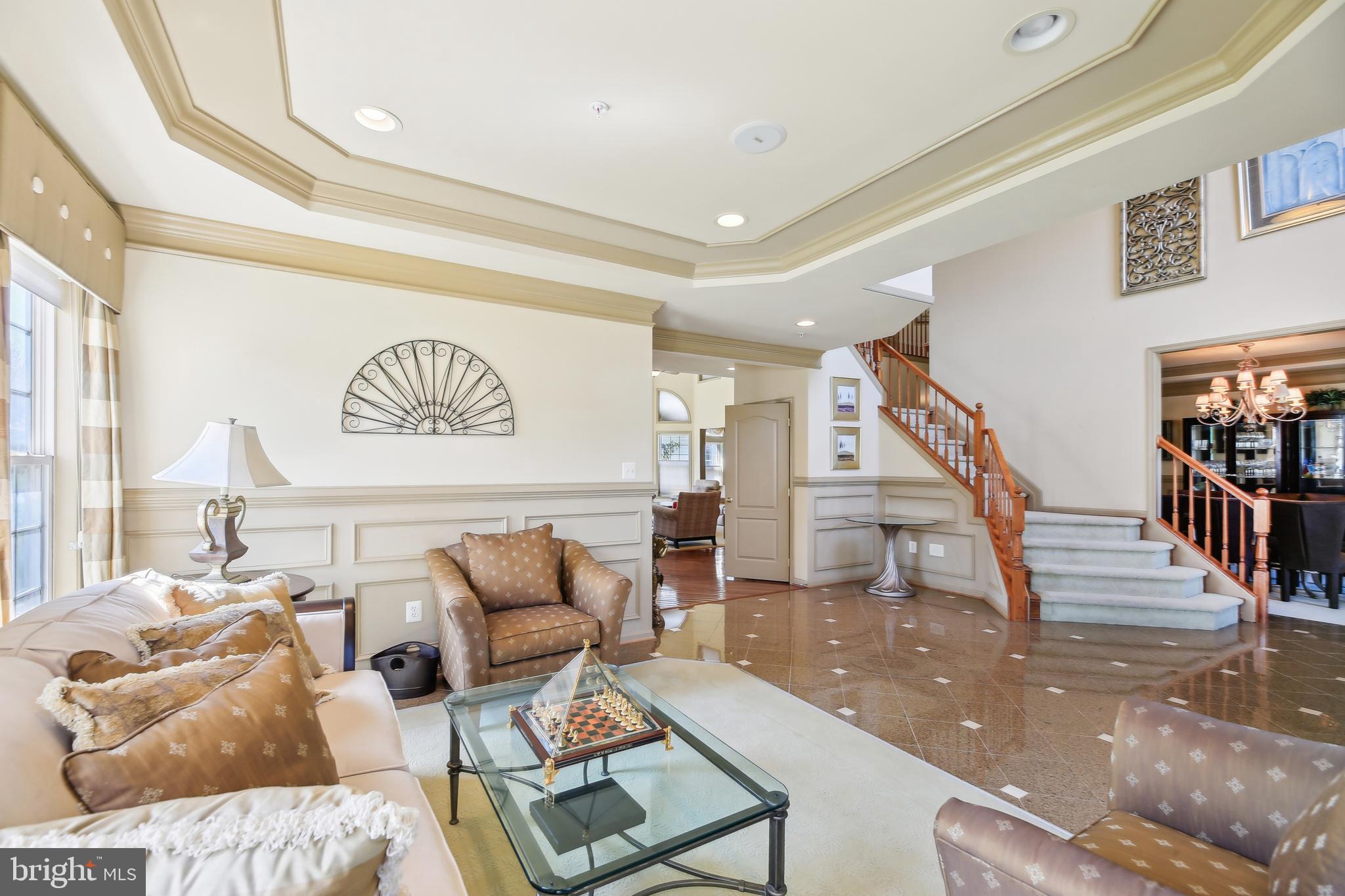 7020 Ironbridge Lane Laurel, MD 20707 - Photo 11 of 63 a living room with furniture and stairs
