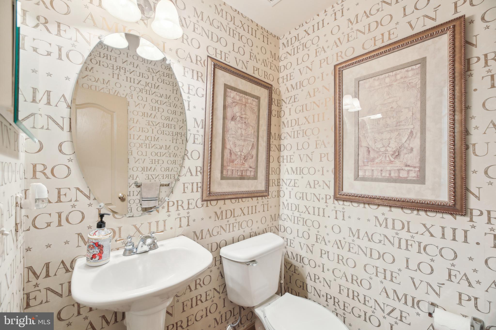 7020 Ironbridge Lane Laurel, MD 20707 - Photo 24 of 63 a bathroom with a sink and mirror with toilet