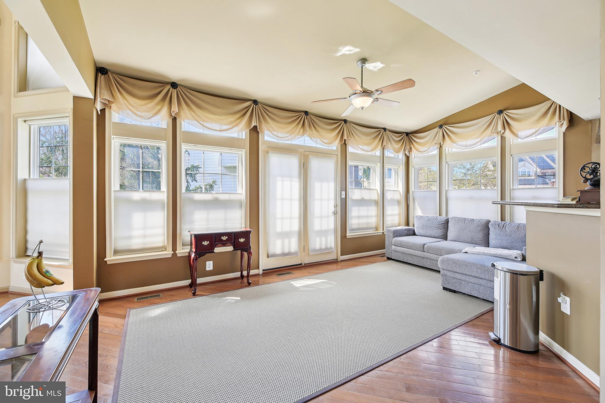 7020 Ironbridge Lane Laurel, MD 20707 - Photo 27 of 63 a living room with furniture and a large window with wooden floor