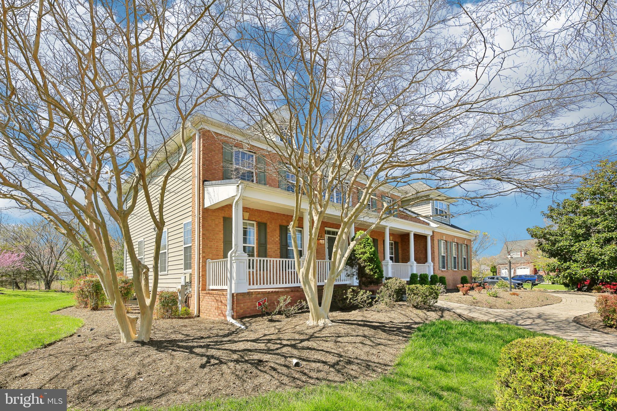 7020 Ironbridge Lane Laurel, MD 20707 - Photo 3 of 63 a view of a house with a yard covered in snow