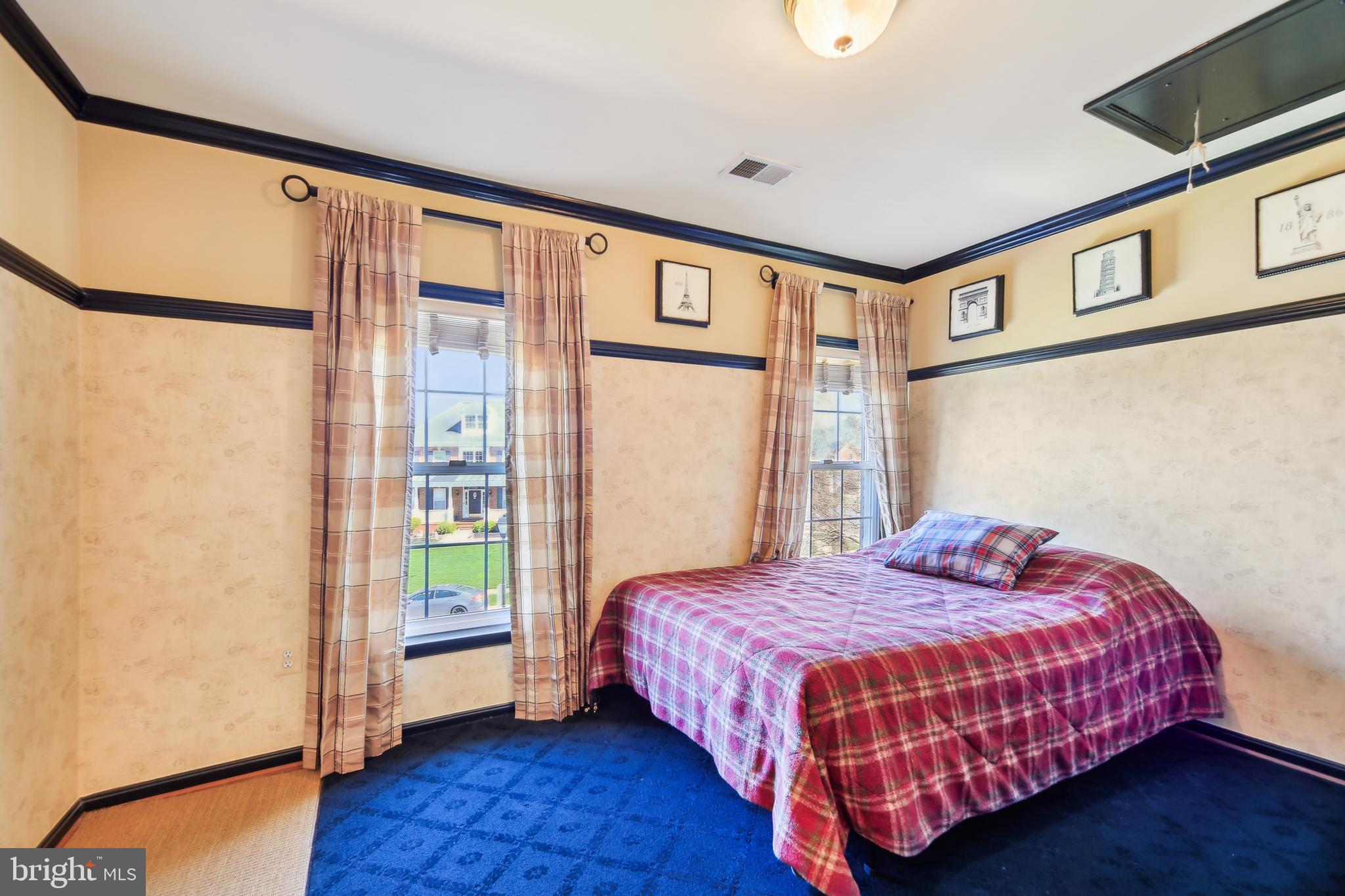 7020 Ironbridge Lane Laurel, MD 20707 - Photo 38 of 63 a bedroom with a bed and a window with the outer view