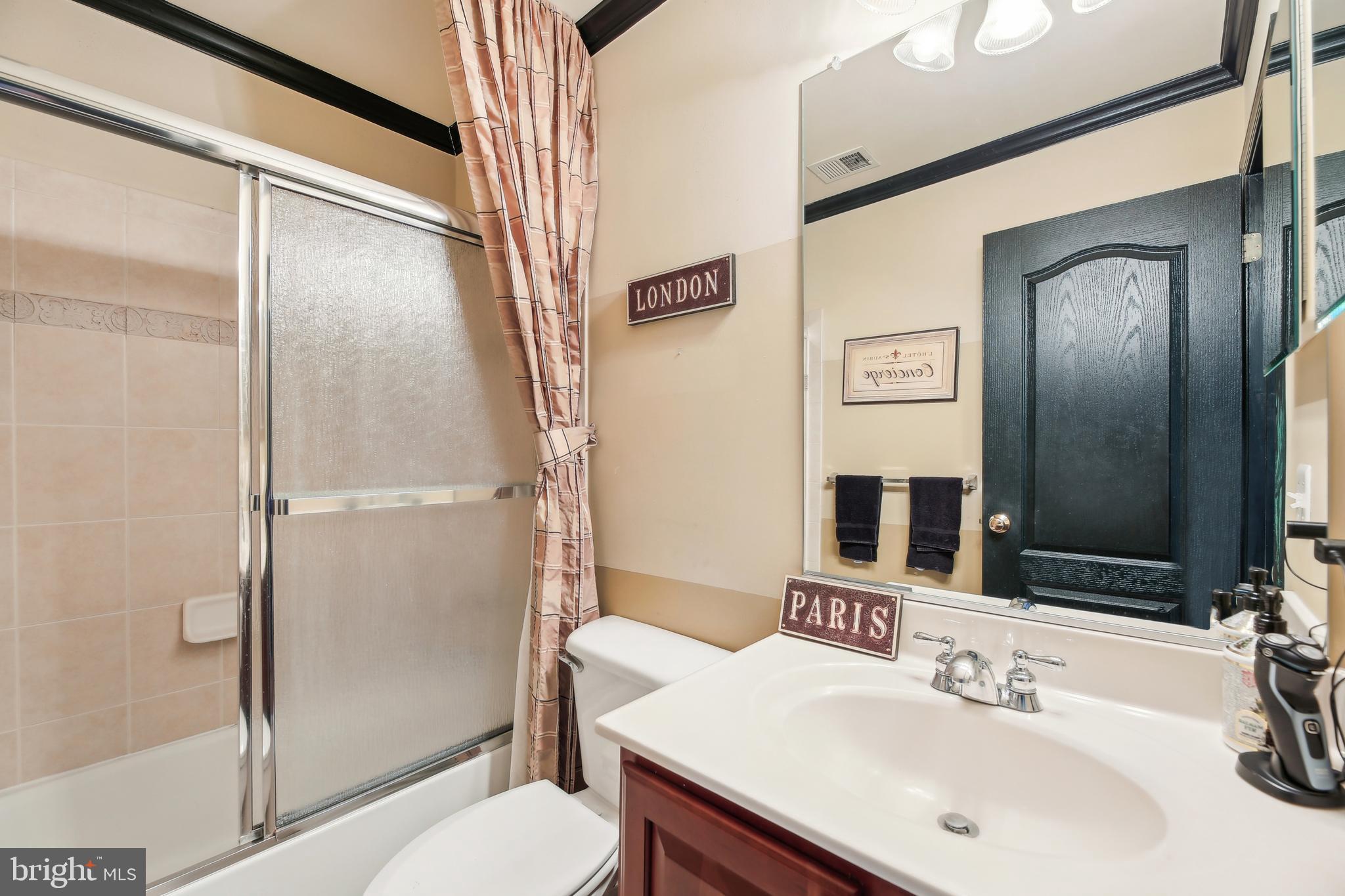 7020 Ironbridge Lane Laurel, MD 20707 - Photo 39 of 63 a bathroom with a sink toilet and shower