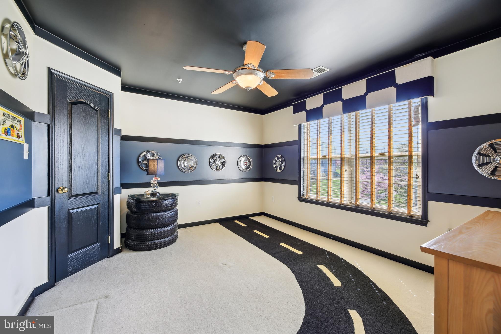 7020 Ironbridge Lane Laurel, MD 20707 - Photo 44 of 63 a bedroom with a bed and a chandelier