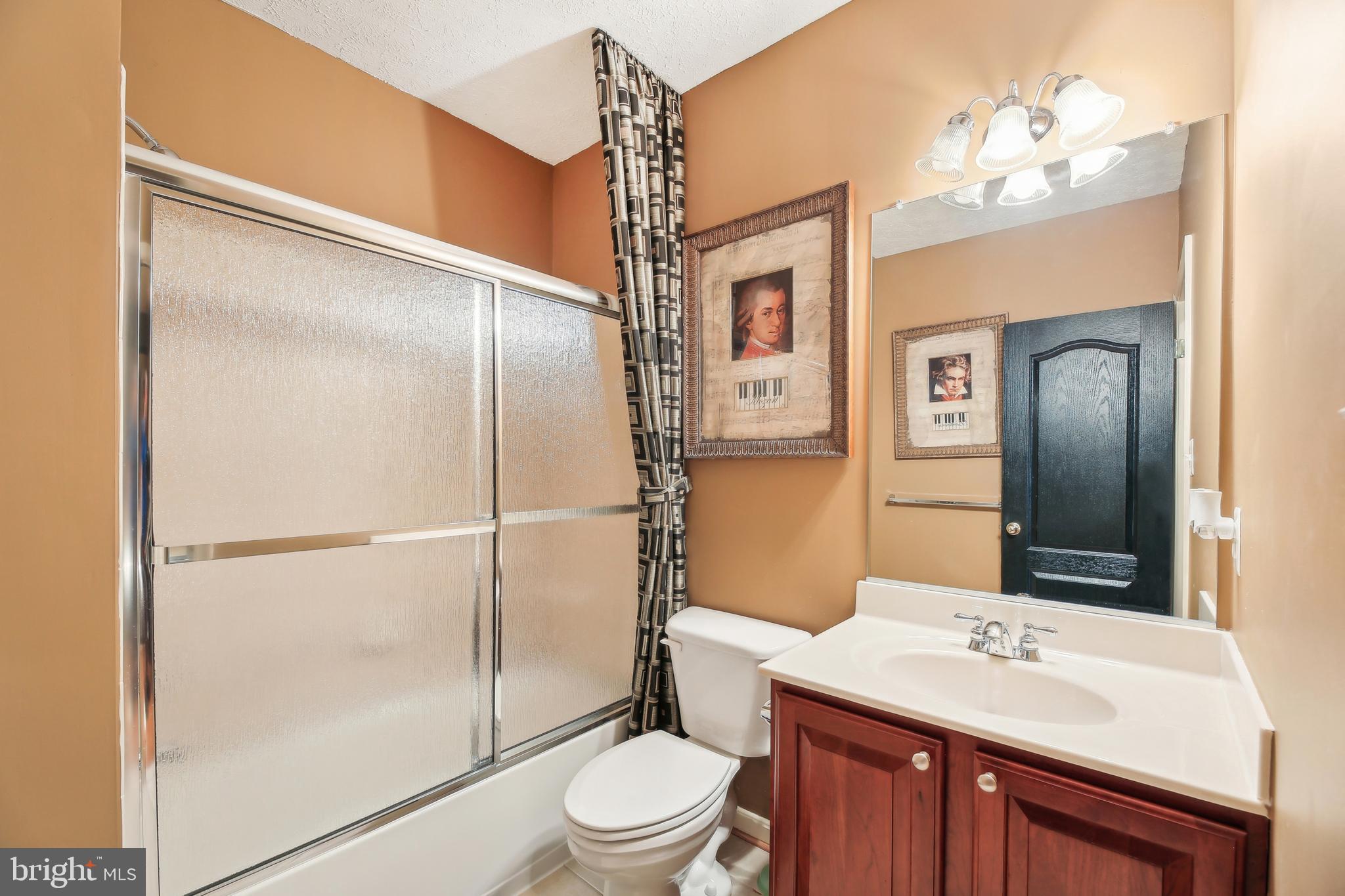 7020 Ironbridge Lane Laurel, MD 20707 - Photo 50 of 63 a bathroom with a sink a toilet and shower