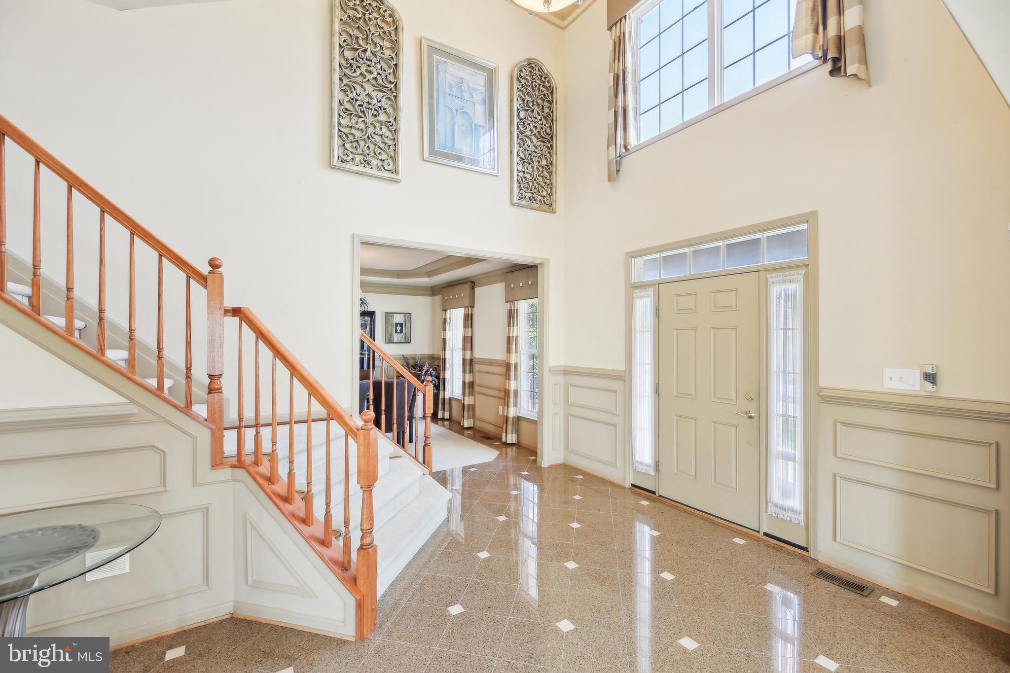 7020 Ironbridge Lane Laurel, MD 20707 - Photo 8 of 63 a view of entryway and hall with wooden floor