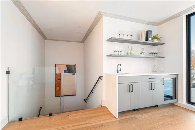 a bedroom with a bed and cabinets