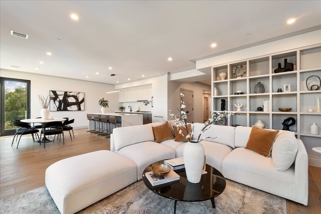 57 University Road, Unit 3 Brookline, MA 02445 - Photo 3 of 21 a living room with furniture and a large window
