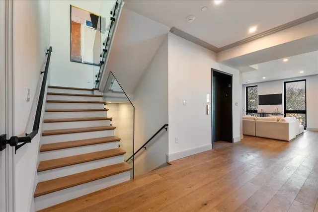 a view of a kitchen with furniture and an empty room