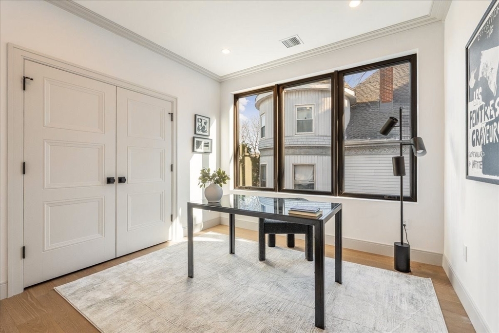 57 University Road, Unit 3 Brookline, MA 02445 - Photo 10 of 20 a view of a livingroom with furniture and window