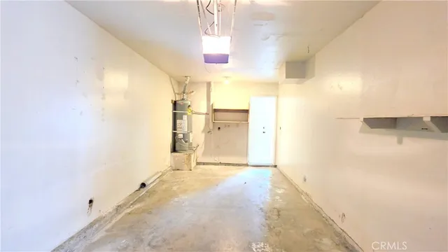 a view of a room with a kitchen