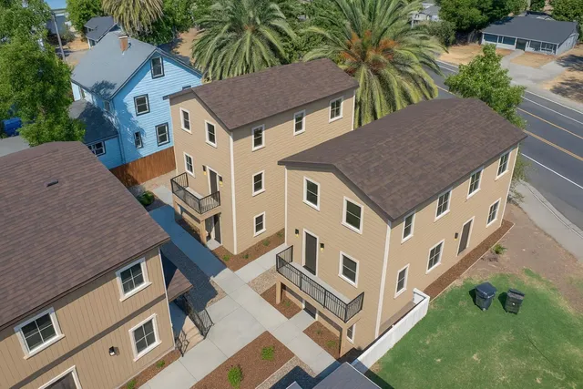a living room with furniture flat screen tv and a fireplace