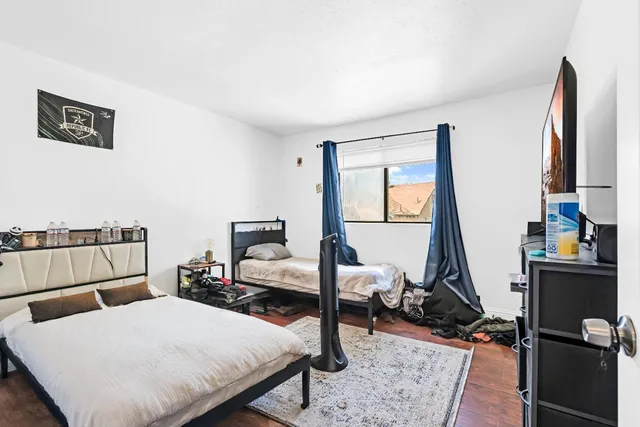 a kitchen with stainless steel appliances granite countertop a refrigerator a stove and a sink