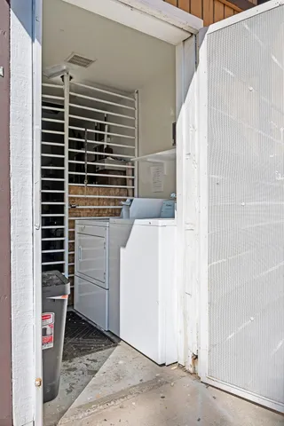 a kitchen with granite countertop wooden cabinets and a stove top oven
