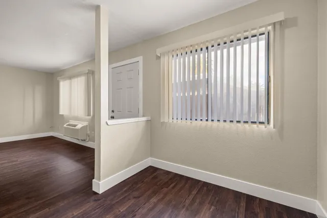 an aerial view of multiple houses with yard