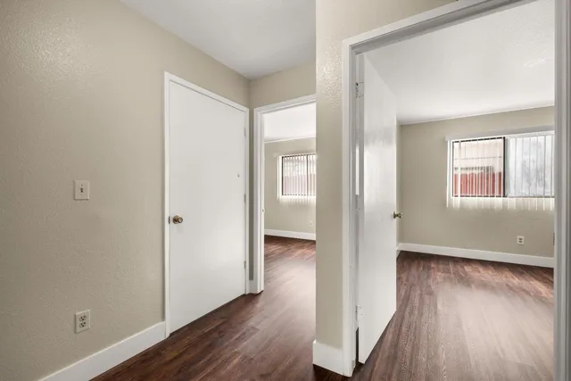 a white toilet sitting next to a sink