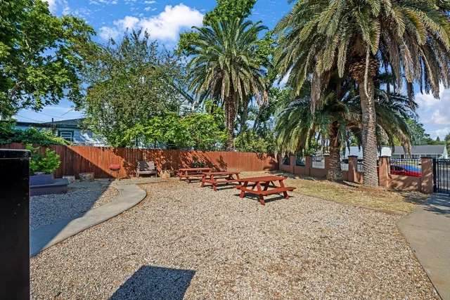 a view of a house with wooden fence