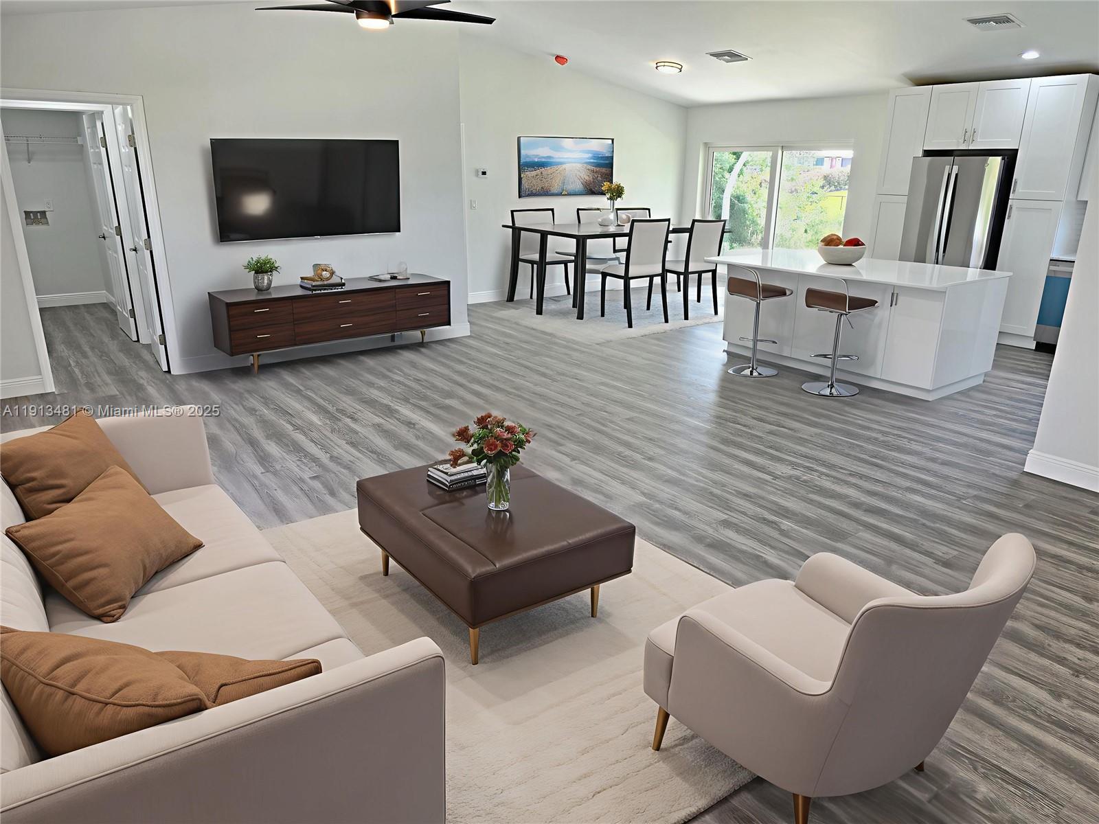 157 Mango Road Northeast Lake Placid, FL 33852 - Photo 4 of 27 Virtually staged living and dining room