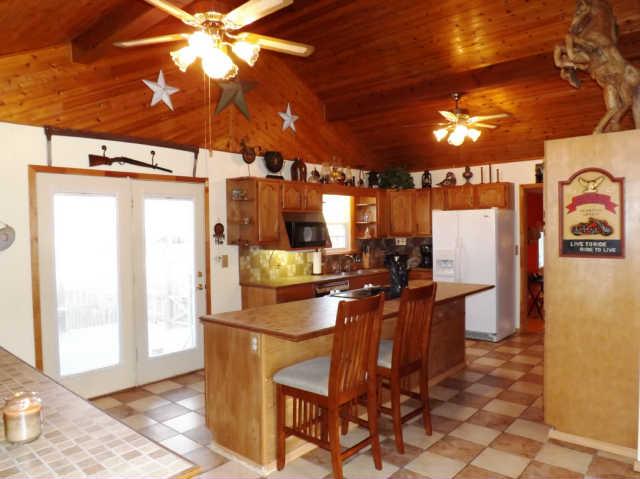 485 High Road Camden, TN 38320 - Photo 6 of 20 a kitchen with stainless steel appliances a stove a refrigerator and island