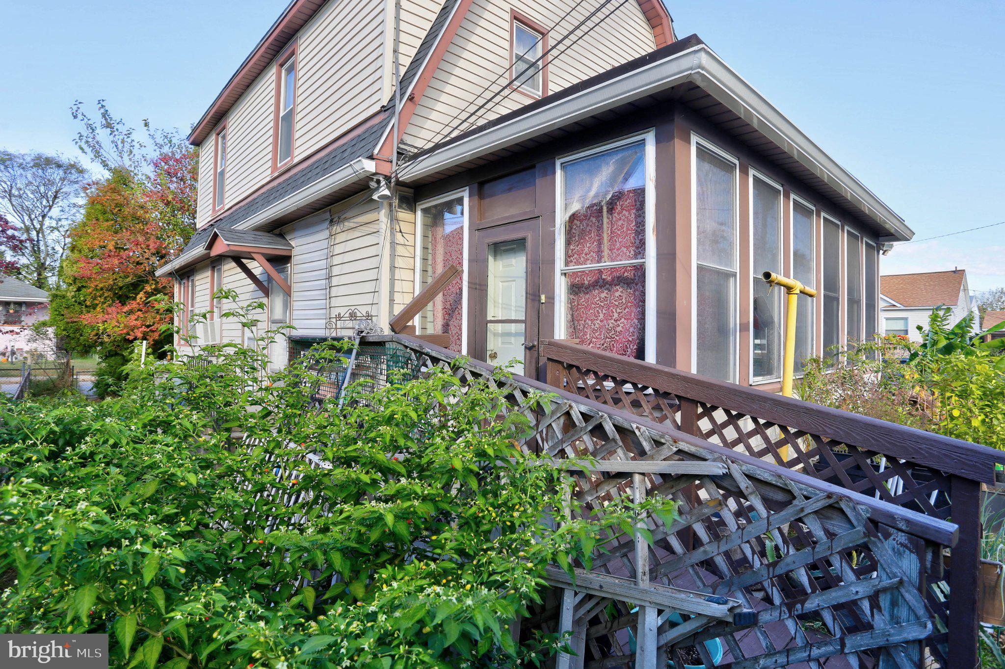 6901 Ridgeway Road Baltimore, MD 21222 - Photo 2 of 26 Charming home with lush greenery.
