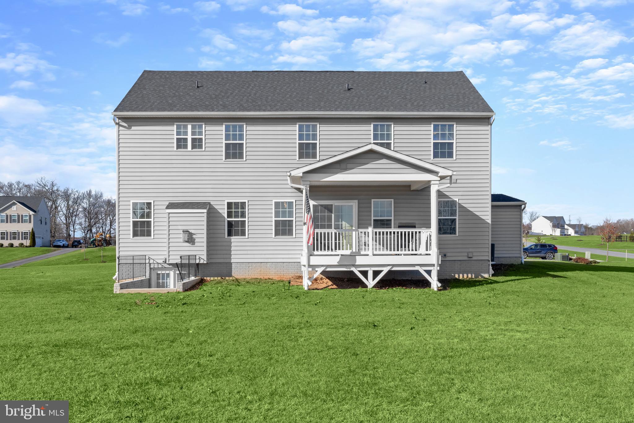 1955 Caple Road Finksburg, MD 21048 - Photo 2 of 2 a front view of a house with a yard and green space