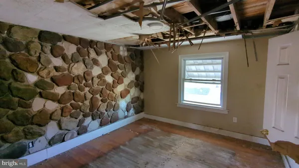 a view of a room with wooden walls