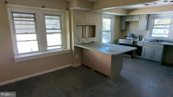 a kitchen with sink cabinets and window