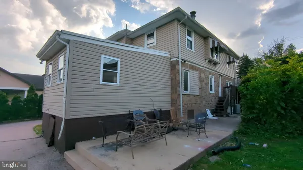 a front view of a house with patio