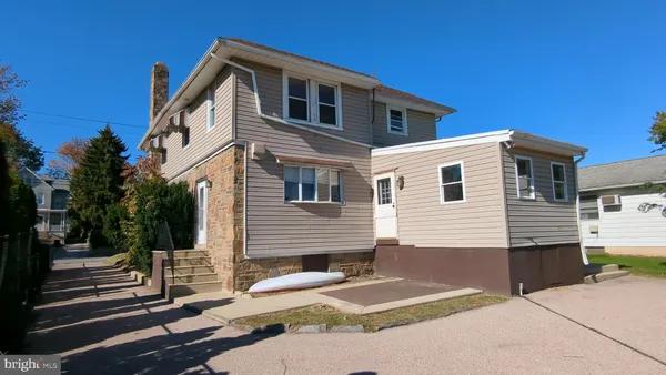 a front view of a house with garage
