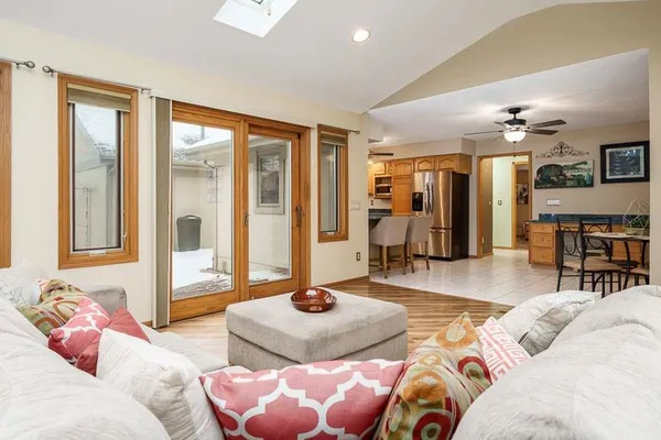a living room with furniture and a large window