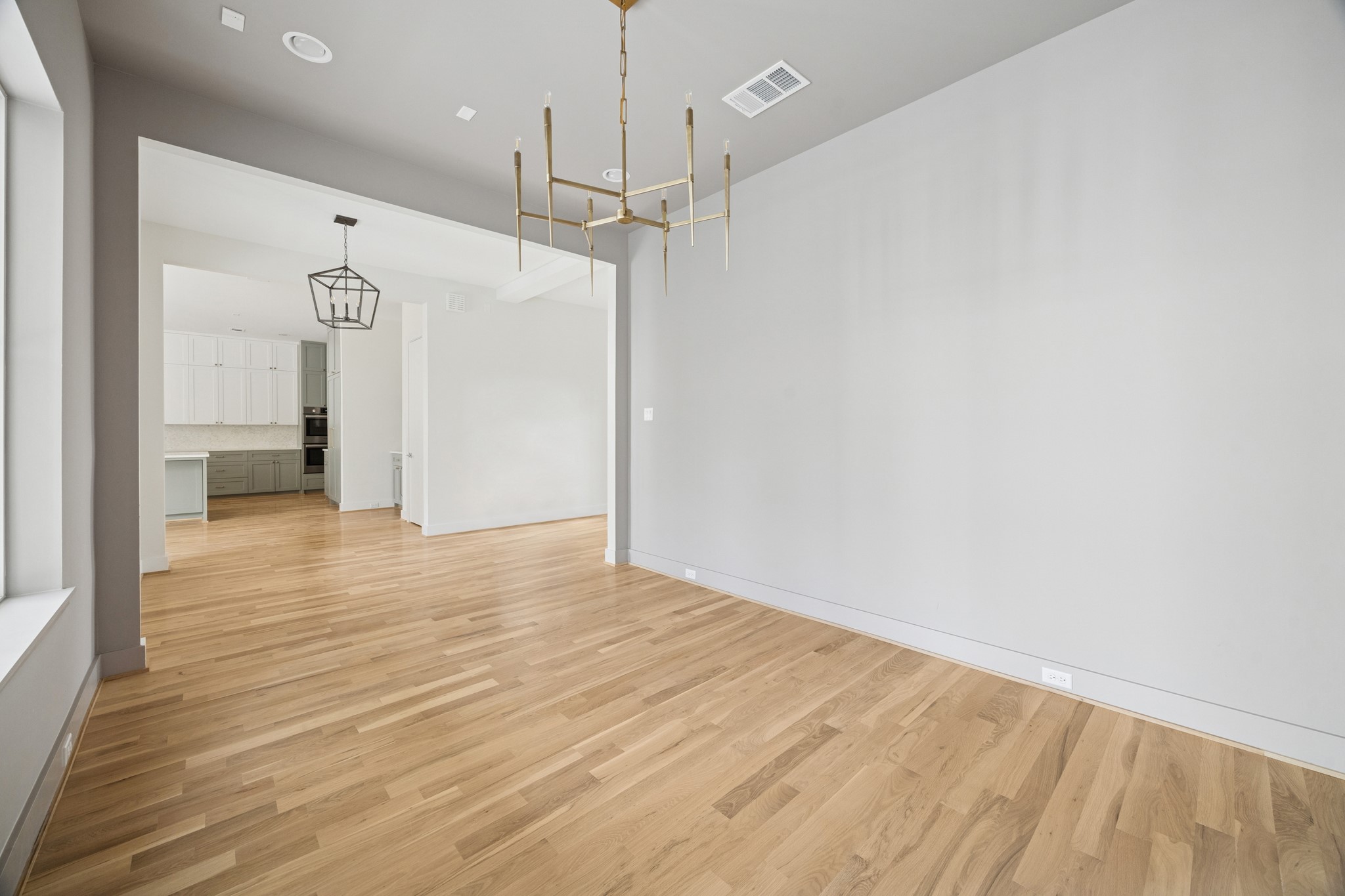 4219 Alba Road Houston, TX 77018 - Photo 15 of 39 a view of empty room with wooden floor