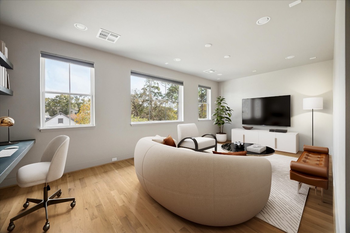 4219 Alba Road Houston, TX 77018 - Photo 19 of 39 Spacious game room with hardwood floors, recessed lighting, and multiple windows providing abundant natural light. *virtually staged*