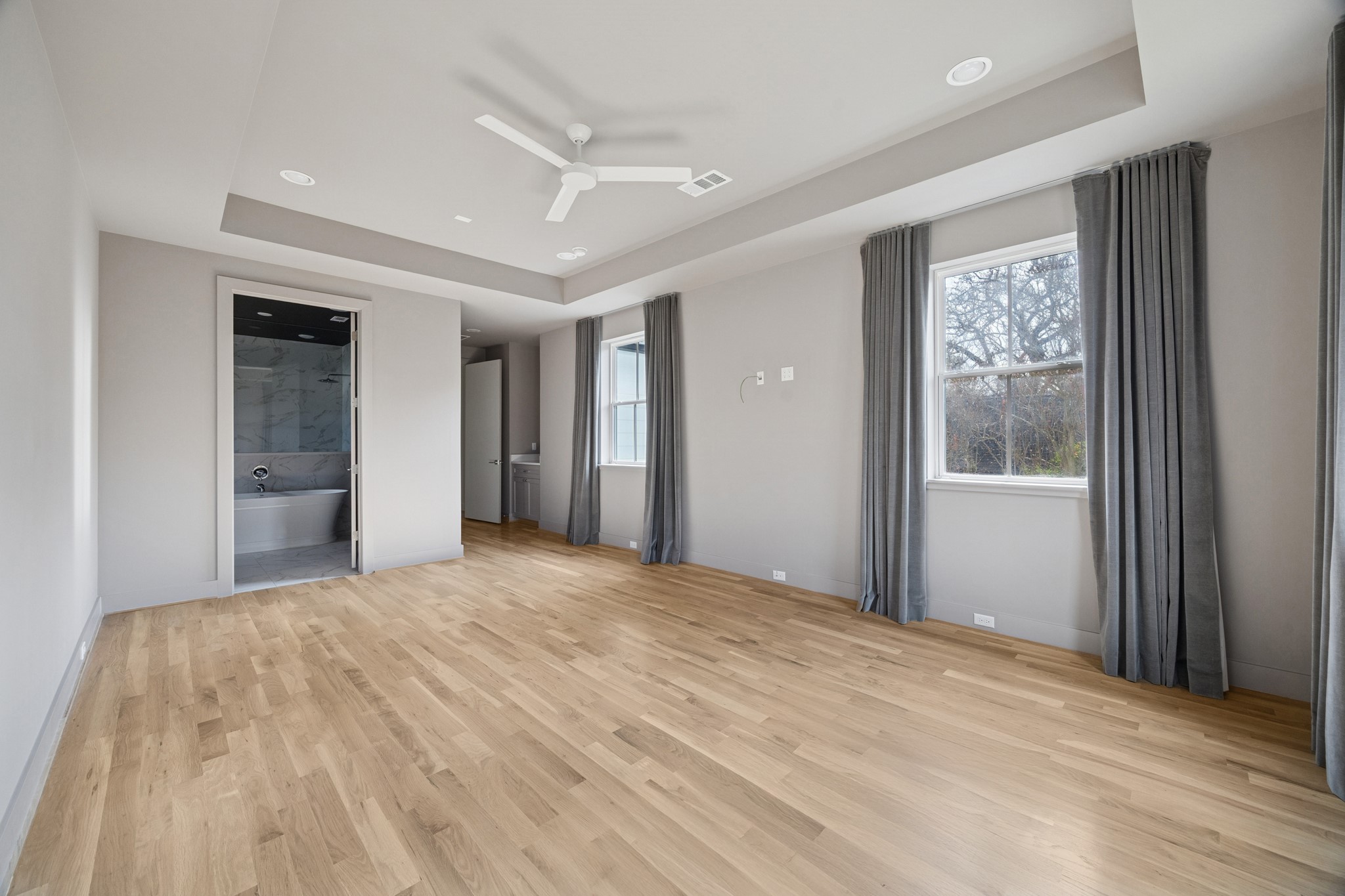 4219 Alba Road Houston, TX 77018 - Photo 22 of 39 a view of an empty room with wooden floor and a window