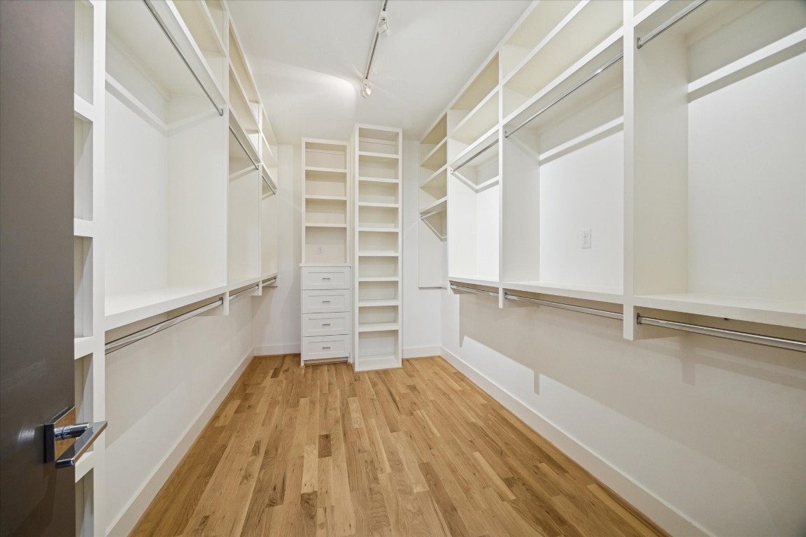4219 Alba Road Houston, TX 77018 - Photo 26 of 39 Generous walk-in closet with custom built-ins, shelving, drawers, and hanging space for exceptional organization.