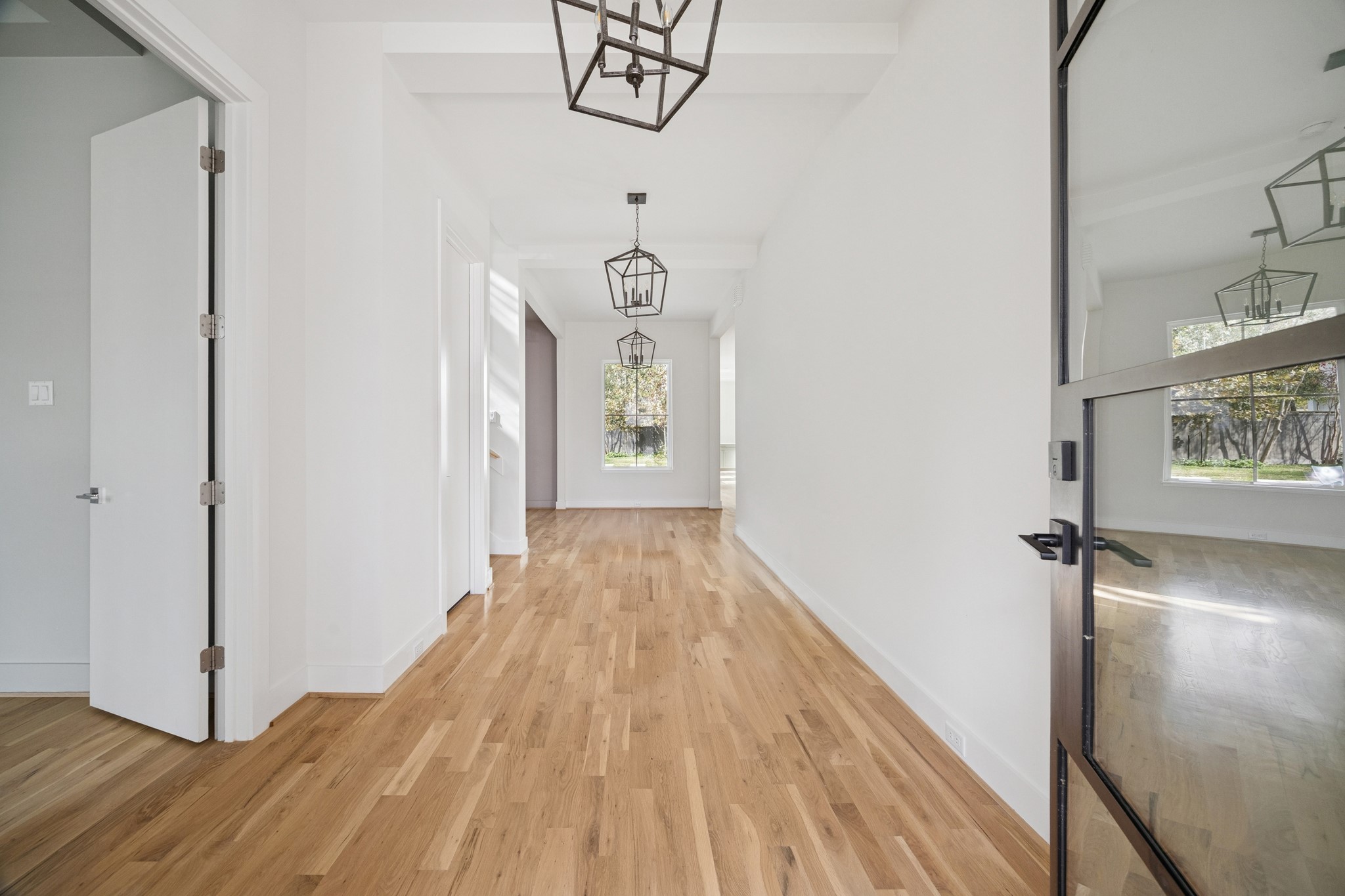 4219 Alba Road Houston, TX 77018 - Photo 3 of 39 a view of a hallway with wooden floor and entryway