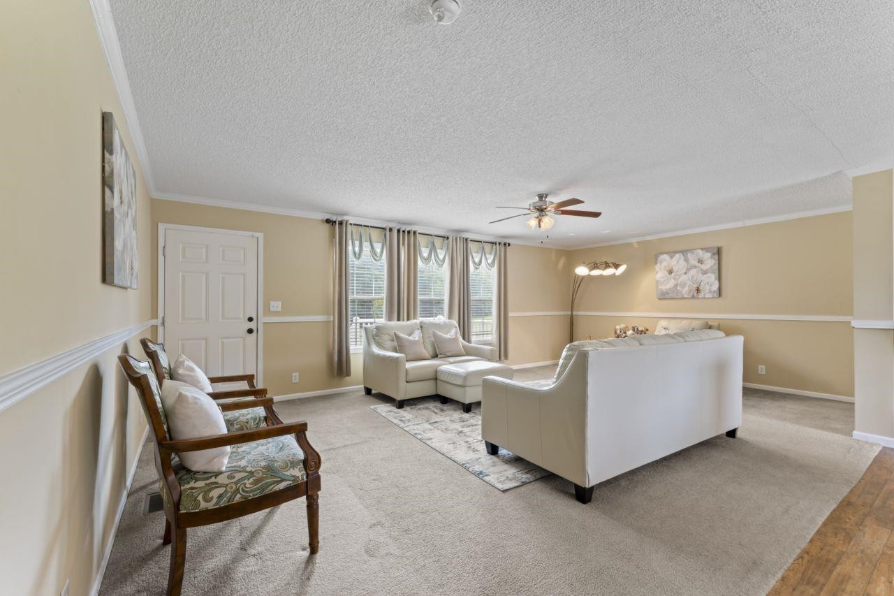 161 Mulchi Road Norlina, NC 27563 - Photo 13 of 38 a living room with furniture and a large window