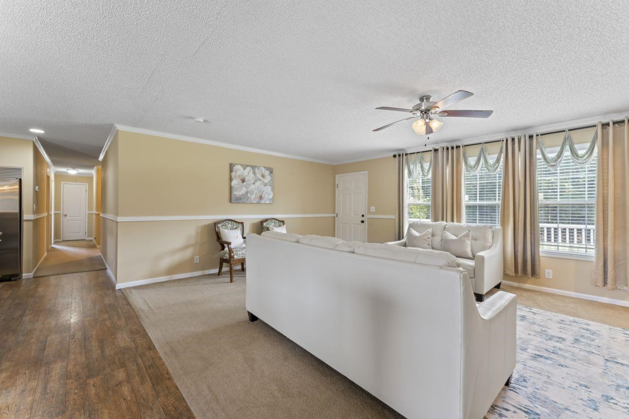 161 Mulchi Road Norlina, NC 27563 - Photo 14 of 38 a living room with furniture and a table